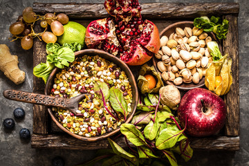 fresh fruit, vegetables, cereals, nuts and greens, the ingredients for a healthy lifestyle, healthy food in a wooden box