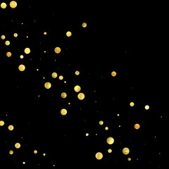 Golden confetti isolated on black background.