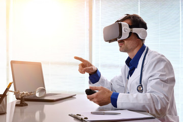 Doctor interacting with content 3d and virtual reality glasses