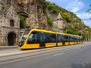 The modern yellow tram in Budapest.