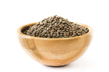 Lentils grain on wooden bowl isolated on white background