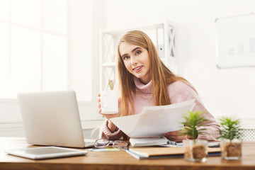 Business woman reading document at office