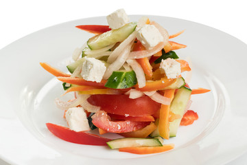 salad of white cabbage with sweet pepper, corn and cheese on a white plate