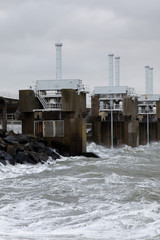 Obraz premium The storm surge barrier Oosterschelde closed for high tide with storm