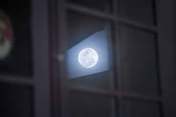 Full moon through window
