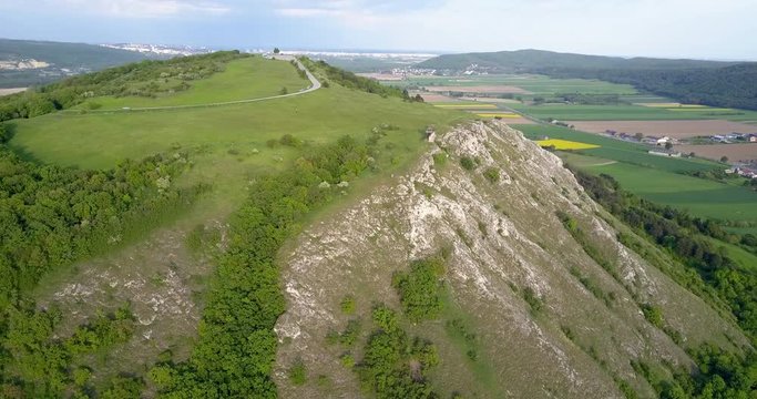 Beautiful scenery and panormatic view towards Hainburg, Austria and Bratislava, Slovakia, with the camera slowly moving sideways and down uncovering the 3D panorama and the side of the Braunsberg hill