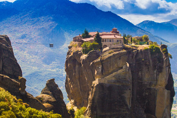Fototapeta na wymiar Greece. Mountain monasteries in Meteora. Buildings on a rock in Greece. Tourism in Greece in the mountains of Meteora.