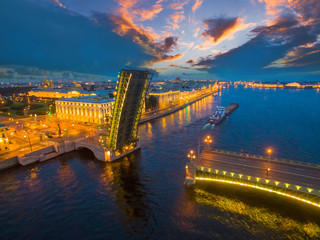 Fototapeta premium Petersburg Russia. Navigation on the river. White nights in Petersburg. The cargo ship passes under the bridge. Neva River. Petersburg bridges. Trinity Bridge.