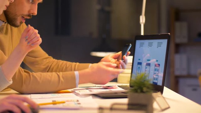 business team with laptop working at night office