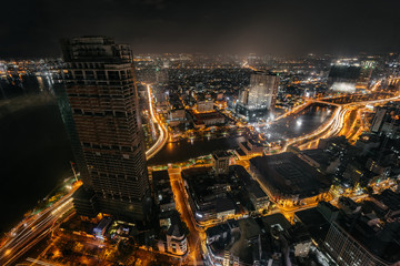 Fototapeta na wymiar Night cityscape of Ho Chi Minh City from the high of Bitexco tower. Traffic trails on street.