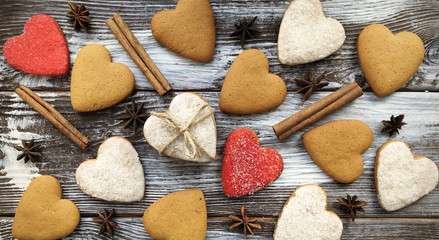 Heart shaped spicy ginger cookies background. Composition for St. Valentine's day. Flat lay, top view.