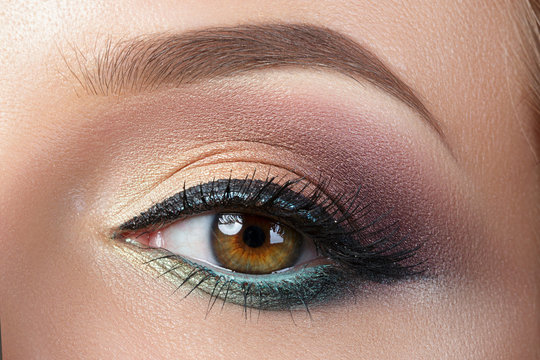 Closeup view of woman eye with evening makeup