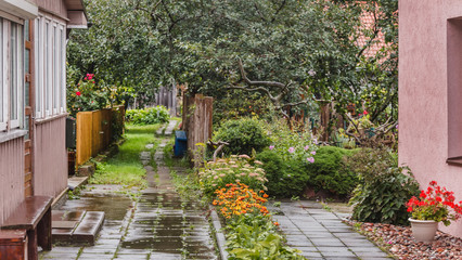 Fototapeta na wymiar rainy cottage with garden