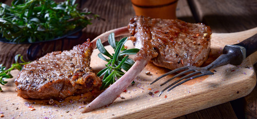 Grilled lamb chops an old board