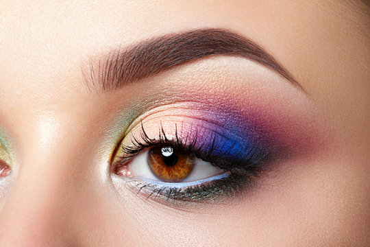 Closeup view of woman eye with evening makeup