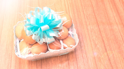 Hen eggs in plastic basket has copy space
