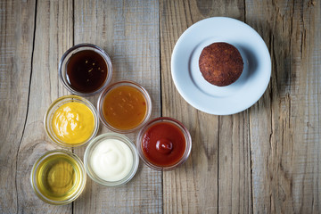 Obraz na płótnie Canvas a variety of sauces and meatballs from chickpeas