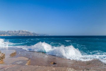 Aerial view of the coast of Montenegro. Storm waves on the Ploče beach.