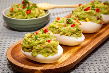 eggs stuffed with guacamole with coriander and chili
