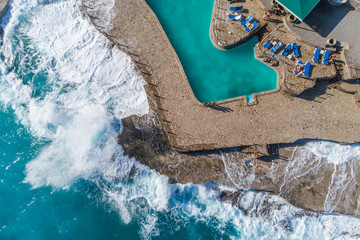 Aerial view of the coast of Montenegro. Storm waves on the Ploče beach.