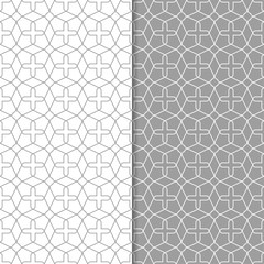 Gray and white geometric ornaments. Set of seamless patterns