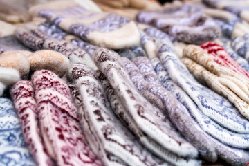 Bunch of handmade colorful woolen mittens