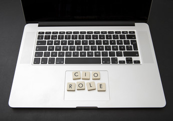 CIO role text written on a modern laptop with letters. Chief information officer title.