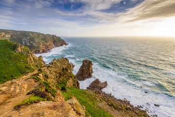Fototapeta na wymiar The rocky coast of the Atlantic ocean. Cape ROCA - the westernmost point of Europe, a popular tourist destination, Portugal.