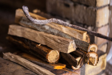stone fireplace with firewood without fire, winter