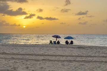 people enjoy the sunset at south beach