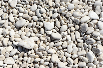 Background image of pebbles on a beach.