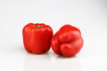 Two fresh red bell peppers