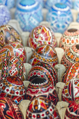 Beautiful colorful homemade ornate, painted decorative Easter eggs. Closeup, shallow depth of field, selective focus.
