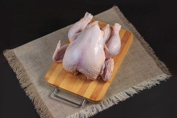 The chicken baked in an oven on a pillow from salt. Preparation of char-grilled chicken.