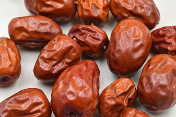 Fresh jujube fruit of the Ziziphus jujuba tree in white background.