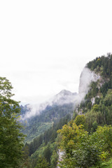 FUSSEN, BAVARIA/GERMANY - September 20, 2017: Landscape of the alps with fog and snow, during summer.
