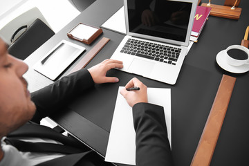 Young lawyer working in office, closeup