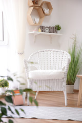 Fototapeta na wymiar Elegant living room interior with white armchair