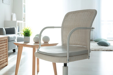 Elegant living room interior with comfortable armchair