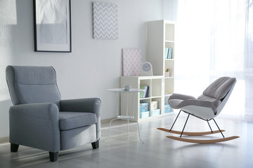 Elegant living room interior with comfortable armchairs