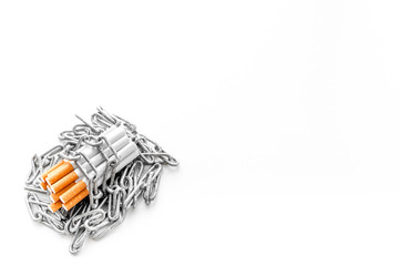 Quit smoking. Cigarettes in chains on white background top view space for text