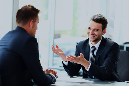 Business people speaking during interview in their office.