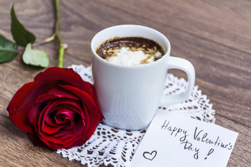 coffee cup with red rose and happy valentine's day message card