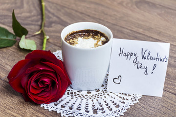 coffee cup with red rose and happy valentine's day message card