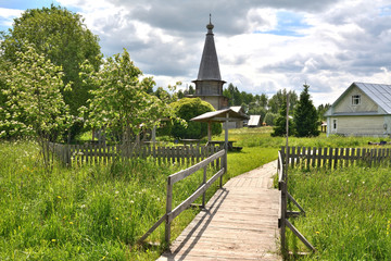 Wooden bridge to the old village temple