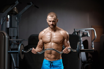 Fototapeta na wymiar Muscular man with barbell