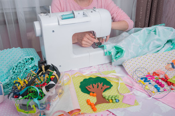 woman stitch at home on sewing machine
