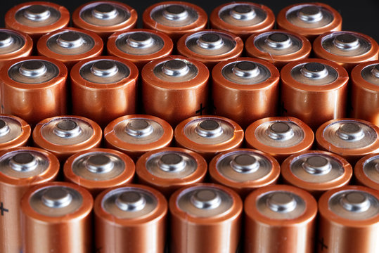 Close up of positive ends of AA batteries, recycle concept