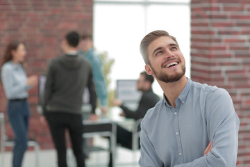 Fototapeta premium Cheerful man smiling in office.