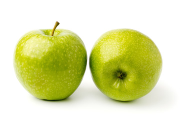 Two ripe green Apple on a white background.